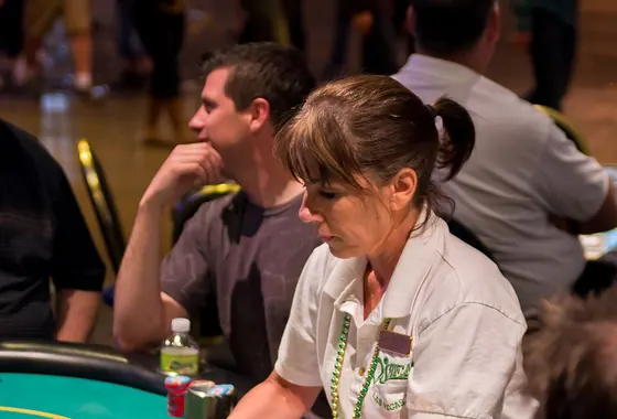 Dealer at a card table